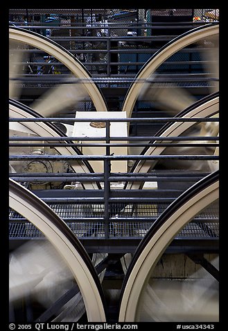 Wheels of cable winding machine in rotation. San Francisco, California, USA