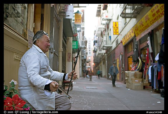 Ehru musician in Ross Alley, Chinatown. San Francisco, California, USA (color)