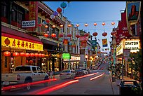 Lanterns and lights on Grant Street at dusk, Chinatown. San Francisco, California, USA