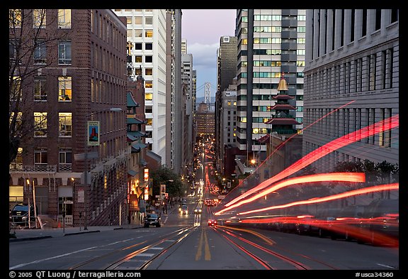 Cable-car rails,  Chinatown, Financial district, and Bay Bridge seen on California street. San Francisco, California, USA (color)