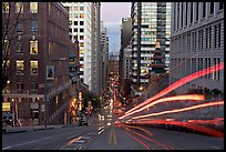 Cable-car rails,  Chinatown, Financial district, and Bay Bridge seen on California street. San Francisco, California, USA (color)