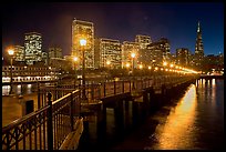 Embarcadero and Transamerica Pyramid seen from Pier 7 at night. San Francisco, California, USA