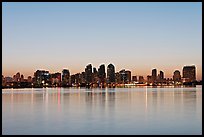 Skyline reflected in the waters of harbor, dawn. San Diego, California, USA