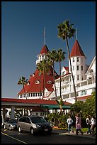 Entrance of hotel del Coronado, with cars and tourists walking. San Diego, California, USA