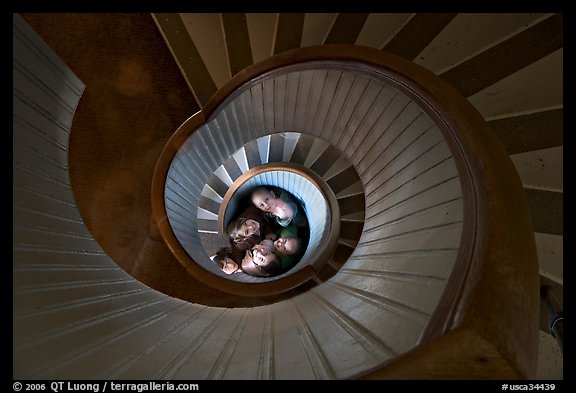 Children standing at the bottom of stairwell, Point Loma Lighthous. San Diego, California, USA (color)