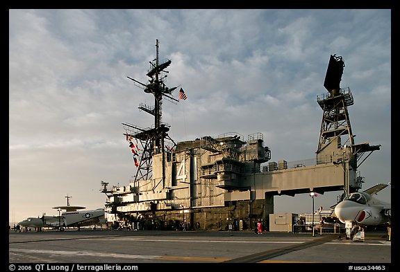 Flight deck and island, USS Midway aircraft carrier, late afternoon. San Diego, California, USA (color)