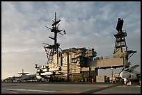 Flight deck and island, USS Midway aircraft carrier, late afternoon. San Diego, California, USA (color)