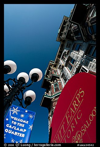 Gaslamp, signs, and facade of the Louis Bank of Commerce, Gaslamp quarter. San Diego, California, USA