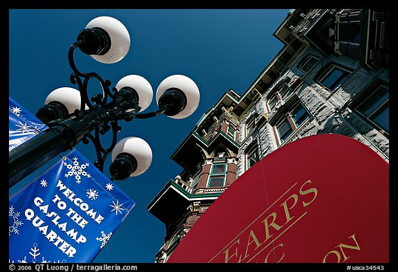 Gaslamp, welcome to Gaslamp quarter signs, and historical building facade. San Diego, California, USA (color)