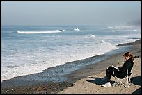 Woman reading on the beach. La Jolla, San Diego, California, USA