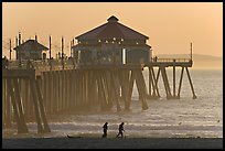 Beachgoers and Huntington Pier, late afternoon. Huntington Beach, Orange County, California, USA (color)