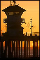 Lifeguard tower on Huntington Pier at sunset. Huntington Beach, Orange County, California, USA