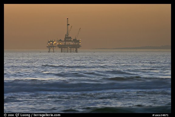 Off-shore petrol extraction  platforms, sunset. Huntington Beach, Orange County, California, USA