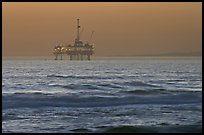 Off-shore petrol extraction  platforms, sunset. Huntington Beach, Orange County, California, USA