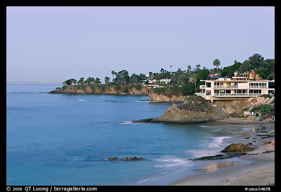 Rocky coastline with waterfront houses at dawn. Laguna Beach, Orange County, California, USA