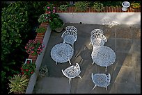 Courtyard with garden chairs and tables. Laguna Beach, Orange County, California, USA