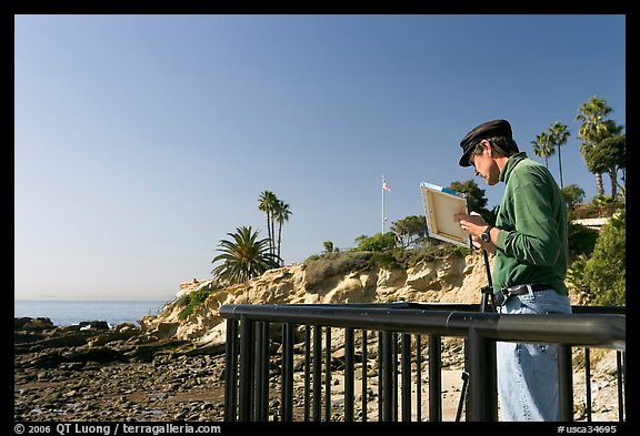 Painter working from an overlook. Laguna Beach, Orange County, California, USA (color)