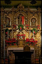 350 year old retablo made of hand-carved wood with a gold leaf overlay. San Juan Capistrano, Orange County, California, USA (color)