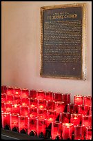 Rows of candles and sign commemorating Father Serra. San Juan Capistrano, Orange County, California, USA (color)