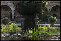 Moorish-style fountain and  courtyard arches. San Juan Capistrano, Orange County, California, USA (color)