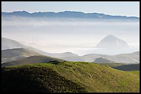 Power plant and Morro Rock seen from hills. Morro Bay, USA