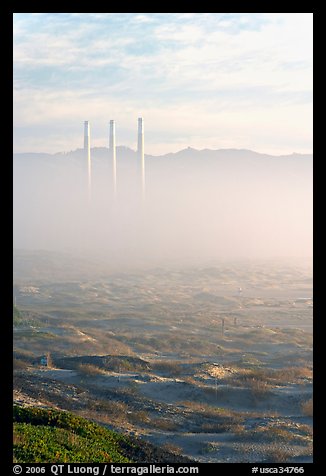 Chimneys of power plant emerging from the fog. Morro Bay, USA (color)