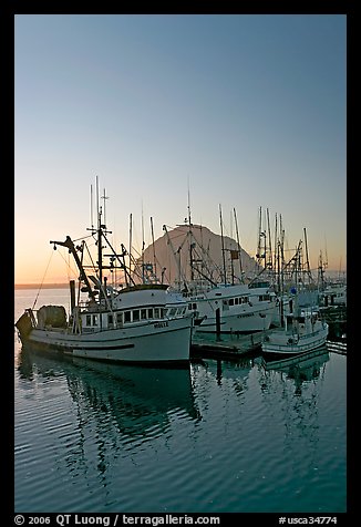 Fishing boats and Morro Rock, sunset. Morro Bay, USA (color)