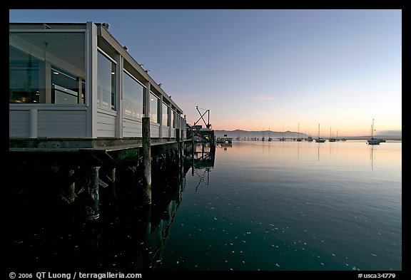 Waterfront restaurant in Morro Bay harbor, sunset. Morro Bay, USA