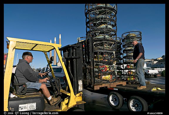 Men loading crab traps onto a truck. Morro Bay, USA (color)
