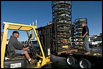 Men loading crab traps onto a truck. Morro Bay, USA (color)