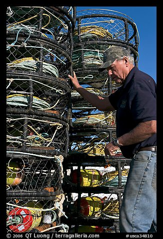 Man loading crab traps. Morro Bay, USA