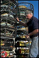 Man loading crab traps. Morro Bay, USA (color)