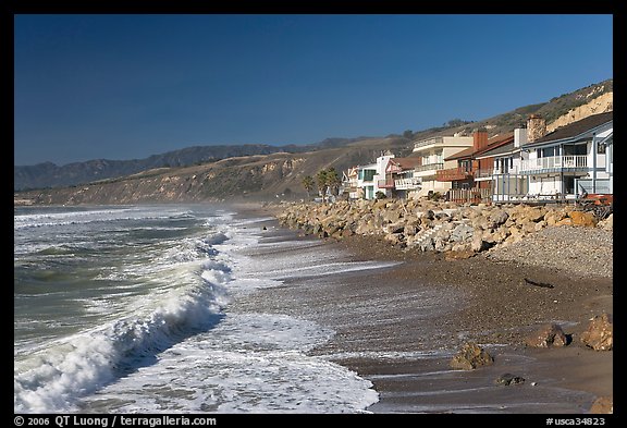 Surf and beachfront houses near Rincon Island. California, USA (color)