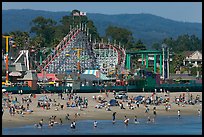 Beachgoers, and Santa Cruz boardwalk roller-coaster. Santa Cruz, California, USA (color)