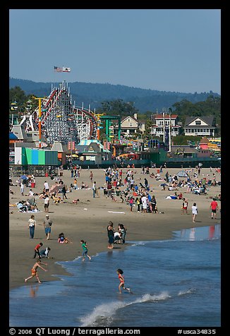 Children, beach, and boardwalk. Santa Cruz, California, USA