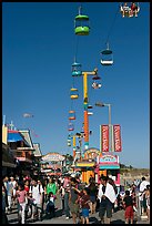 Crowd on the beach boardwalk on a summer afternoon. Santa Cruz, California, USA ( color)