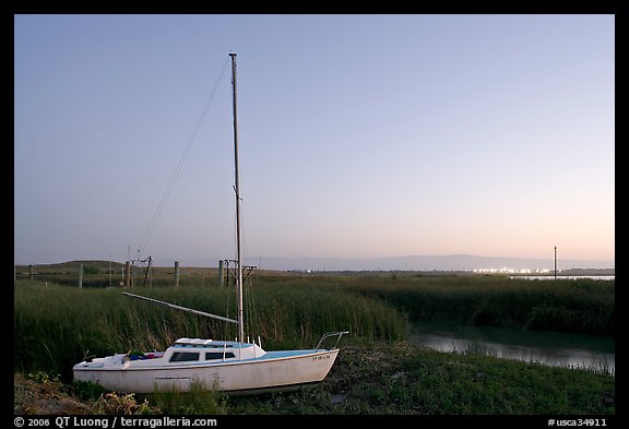 Yacht and marsh at dusk, Alviso. San Jose, California, USA (color)