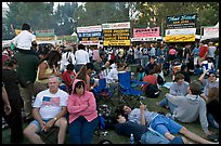 Crowd sitting on the grass in Guadalupe River Park, Independence Day. San Jose, California, USA