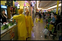 Buddhist nuns in the foot court of the Grand Century mall. San Jose, California, USA