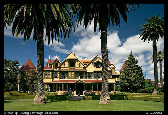 Palm trees and mansion facade. Winchester Mystery House, San Jose, California, USA (color)