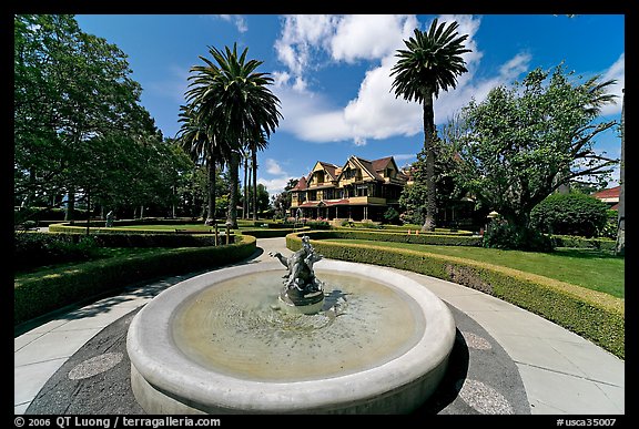 Wide view of fountain, gardens,  and mansion. Winchester Mystery House, San Jose, California, USA (color)