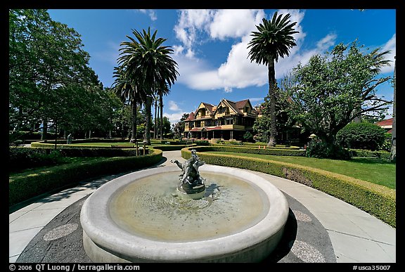 Wide view of fountain, gardens,  and mansion. Winchester Mystery House, San Jose, California, USA