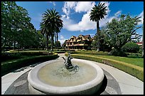 Wide view of fountain, gardens,  and mansion. Winchester Mystery House, San Jose, California, USA (color)