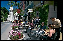 Lunch at streetside restaurant tables. Santana Row, San Jose, California, USA (color)