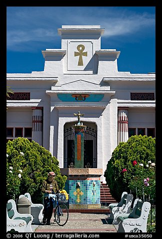 Person walking a bike, Rosicrucian Park. San Jose, California, USA