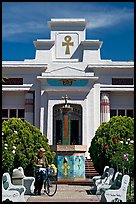 Person walking a bike, Rosicrucian Park. San Jose, California, USA