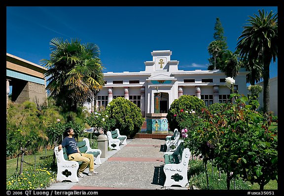 Visitor sitting on a bench, Rosicrucian Park. San Jose, California, USA (color)