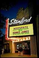 Couple standing in front of Stanford Theatre at night. Palo Alto,  California, USA