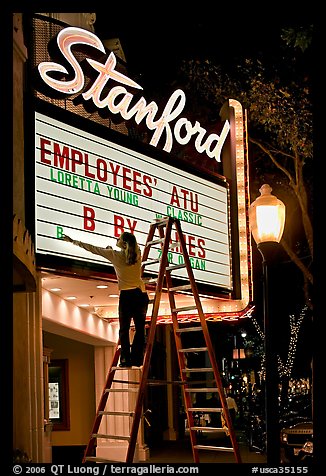 Woman changing movie title, Stanford Theatre. Palo Alto,  California, USA (color)