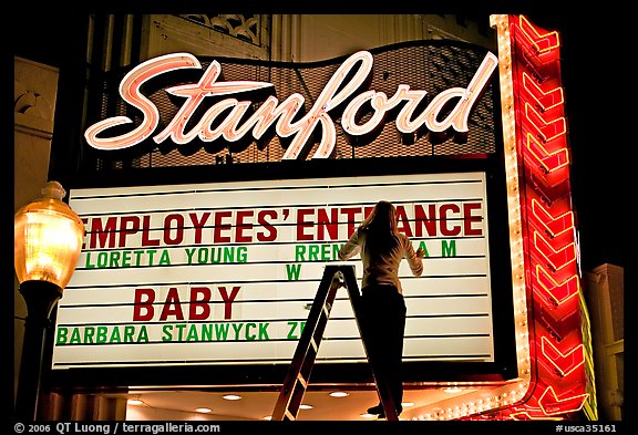Neon signs and movie title being rearranged, Stanford Theater. Palo Alto,  California, USA (color)